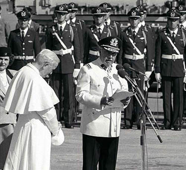 Pope John Paul II listens to a speech by Chilean leader Augusto Pinochet in Santiago, on April 1, 1987.
