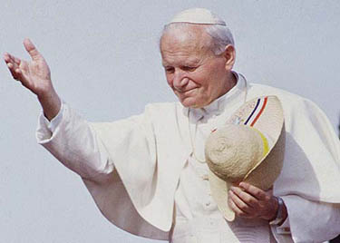 Pope John Paul II holds a typical hat worn called a piri hat worn by Paraguayan farmers during an open-air mass given during a three-day visit in Asuncion, May 17, 1988