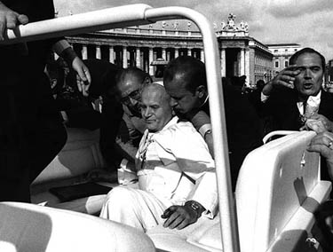 Pope John Paul II (C) lies bleeding in his open car moments after he was shot by Turkish gunman Mehmet Ali Agca in St. Peter's Square on May 13, 1981