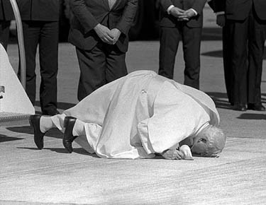 Pope John Paul II kisses the ground upon his arrival in Chile on April 1, 1987. 