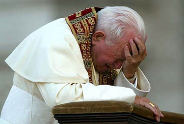 Pope John Paul II prays in Saint John of Laterano Basilic where he celebrated a Mass and headed a procession through Rome to celebrate the Roman Catholic feast of Corpus Domini on June 19, 2003