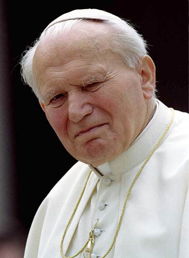 Pope John Paul II grimaces during his weekly general audience in Rome on October 2, 1996. 