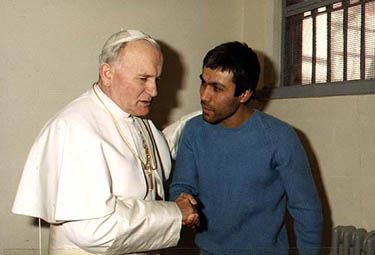 Pope John Paul (L) meets the man who tried to assassinate him on May 13, 1981, Turkish Mehmet Ali Agca, in the prison in Rebibbia in Italy, on December 27,1983