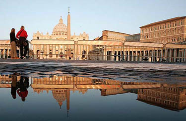 Reflections are seen in a puddle in front of Saint Peter's Square at the Vatican on April 1 when Pope John Paul was in a "very grave" condition. 