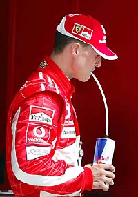 Ferraris Michael Schumacher sips a drink after the first qualifying session of the Bahrain Formula One Grand Prix 