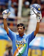Rahul Dravid raises his arms after completing his century in the first ODI against Pakistan in Kochi on Saturday