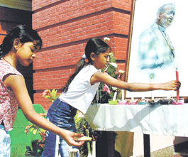 Children lighting candles in memory of Pope John Paul II at Sacred Heart Cathedral in the Capital.