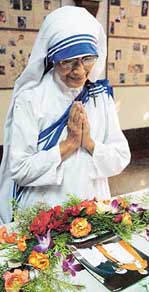 Sister Nirmala, Superior General of Missionaries of Charity, prays in front of a picture of Pope John Paul-II in Kolkata on Sunday
