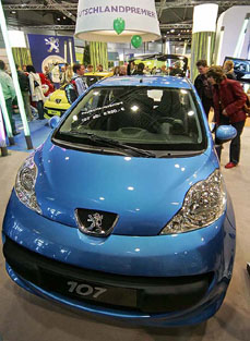 Visitors look at the new French Peugeot 107 at the auto show Auto Mobil International (AMI) in Leipzig, eastern Germany, on Sunday. More than 460 exhibitors from 23 countries will present their newest automobiles in Leipzig until April 10.