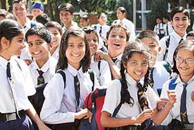 Schoolchildren smile as they get back to school after vacation. City schools reopened for the new academic session in Chandigarh