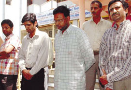 The four persons accused of cheating Janta Co-operative Bank in police custody in the Capital on Monday. 