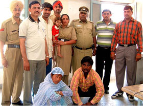 Meenu, Satish Kumar, and the kidnapped child, Luv, in the custody of a Delhi police team in Bathinda on Monday. 