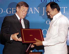 Finance Minister P. Chidambaram exchanges documents with German Minister of Economics and Labour Wolfgang Clement after signing a joint statement in New Delhi