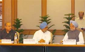 Prime Minister and Chairman Planning Commission Manmohan Singh with Commissions Deputy Chairman Montek Singh Ahluwalia during the Full Planning Commission meeting to discuss the draft mid-term appraisal of the 10th plan at PMs residence in New Delhi