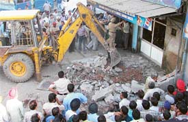 A demolition drive in progress in Ludhiana on Tuesday