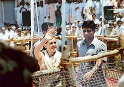 Congress President Sonia Gandhi waves to the crowd at the closing ceremony of the re-enactment of  the 75th anniversary celebrations of the Dandi march at Dandi in Gujarat on Wednesday. 