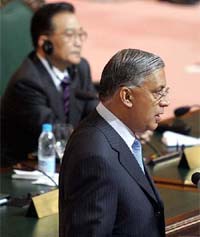 Pakistan Prime Minister Shaukat Aziz speaks while Chinese Premier Wen Jiabao (background) looks on during an inaugural session of the fourth Ministerial Meeting of the Asia Cooperation Dialogue in Islamabad