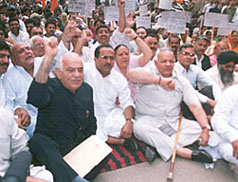 BJP leader Madan Lal Khurana leads a dharna of party activists outside Raj Bhavan in Jammu on Thursday. The dharna was organised to protest against the Centre allowing Pakistanis to enter Kashmir through the Muzaffarabad road on the basis of permit. Also seen in the picture are Mr Chaman Lal Gupta, a former Union Minister, and the state BJP chief Nirmal Singh. 