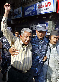 The Nepal police arrests former minister Deep Kumar Upadhaya during the pro-democracy protest at New Road in Kathmandu 