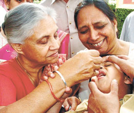 Delhi Chief Minister Sheila Dikshit administering polio drops to a child in the Capital on Saturday. 