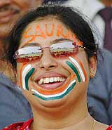 A young lady cheering the Indian team during the third one-day international