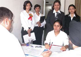 Students of the Army Institute of Law interact with corporate representatives at a career fair at Mohali