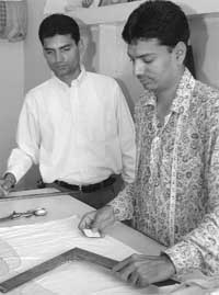 Deaf-mute brothers Bikramjeet and Partap in their tailoring sho