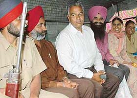Accused in the Burail jailbreak case being taken away in a police vehicle after charges were framed against them by a Chandigarh court