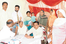 A doctor examines a patient at a medical camp organised by the Masihi Ekta Dal