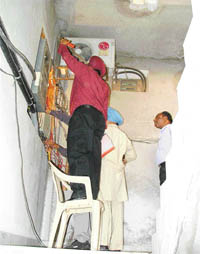 PSEB teams conduct a load checking operation at Jannat Beauty Parlour in Ludhiana on Monday