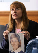 Chicago resident Barbara Baline, who arrived to represent some 5,600 members of the survivors network of those abused by priests (Snap), holds a photo of herself taken at age 12 during a news conference in Rome on Monday. 