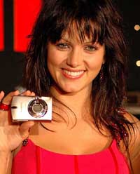 Model Yana Gupta holds a digital camera during the launch of Canons range of 28 products in New Delhi on Tuesday.