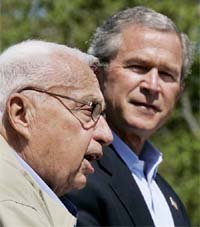 US President George W.Bush listens to Israeli Prime Minister Ariel Sharon during a joint press conference at Bush's Texas ranch in Crawford