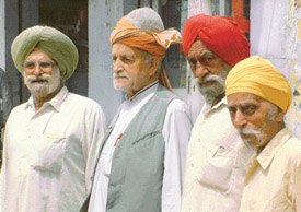 Former residents of Peshwar sporting their traditional headgear