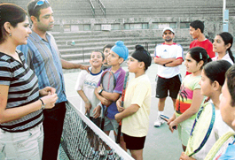 Saadgi Rajani of Gujarat returns a shot during AITA talent series at the Lake Club, Chandigarh, on Wednesday.