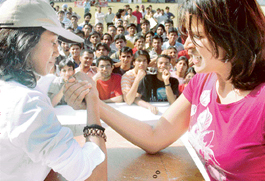 Beauty and brawn: For these two students it was time for a show of strength at an arms wrestling match during PEC Fest in Chandigarh on Wednesday.