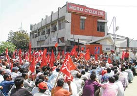 Workers of Hero Cycles protest outside the factory in Ludhiana