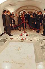 Mourners file past the tomb of the late Pope John Paul II at the Vatican's St Peter's Basilica grotto on Wednesday after it was opened to the public. 