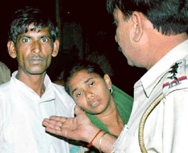 A police personnel consoles parents of Sheela who allegedly committed suicide in her employers house in Mansa Devi Complex, Sector 4, Panchkula, on Thursday.