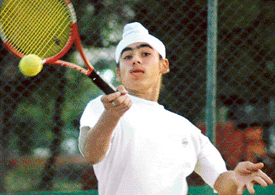 Mandeep Singh returns a shot during AITA talent series at Lake Club, Chandigarh, on Thursday.