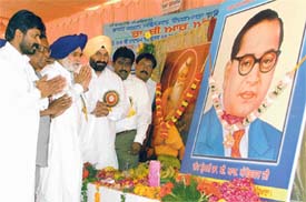 Mr Charanjit Atwal, Mr Maheshinder Grewal and Mr Vijay Danav pay tributes to Dr B.R. Ambedkar on his 114th birth anniversary at Daresi Grounds in Ludhiana