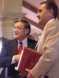 Union Civil Aviation Minister Praful Patel (right) shakes hands with US Secretary of Transportation Norman Y Mineta after signing an aviation agreement in New Delhi on Thursday.