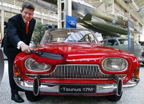 General Manager of Ford Germany Bernhard Mattes dusts a 1963 Ford Taunus 17M at Speyers Technical Museum on Friday. The museum is putting on a special show on the occasion of Ford Germanys 80th anniversary. The first Ford produced in Germany was completed in Cologne on August 18, 1925. 