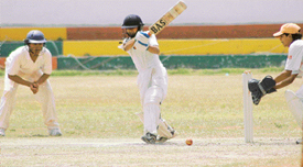 A player hits the ball at the under-15 Punjab Inter-District Cricket Tournament being played at DAV-8 grounds, Chandigarh, on Friday.