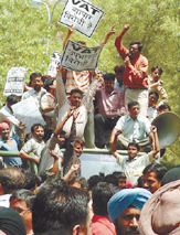 Traders and consumers under the banner of Confederation of All India Traders protesting against the implementation of VAT at Parliament Street in the Capital on Friday.
