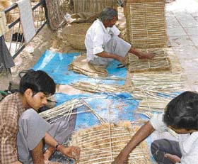 Vendors selling cooler pads await customers in Sector 22, Chandigarh