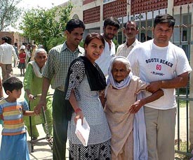 107-year-old Narayani Devi being taken to a polling booth by her family members in Hisar on Saturday