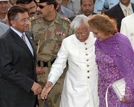 Welcome, says Foreign Minister Natwar Singh as he escorts Pakistan President Pervez Musharraf and Mrs Sehba Musharraf on their arrival at the Air Force Station, Palam, in New Delhi on Saturday. 