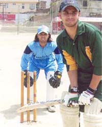 Ravi Verma, lookalike of wicketkeeper Mohinder Singh Dhoni, plays a match in Ludhiana on Friday