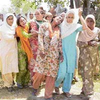 Wailing sisters of deceased Gurmeet Singh at Uccha Jattan village on Saturday